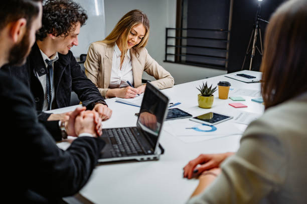 istock Young people at business meeting 1355494976