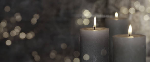 istock Candles in haze with mystery bokeh 1355499393