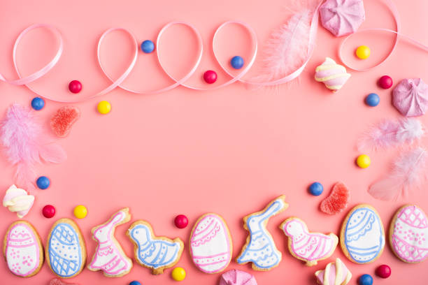 istock Homemade Easter cookies on pink background flat top view 1355499784