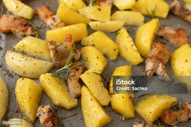 Potato Wedges Oven Roasted With Rosmary In A Baking Tray Stock Photo - Download Image Now