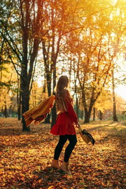 Feel-good Self-care Ideas For Fall, Autumn Self-Care Activities, celebrate the fall season. Young beautiful woman enjoying autumn nature and sun