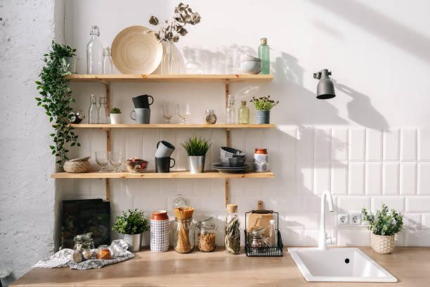 istock Scandinavian style shelves in kitchen in white tones 1355500949