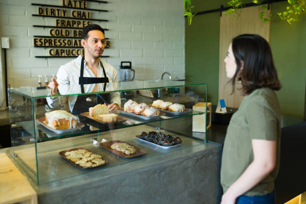 istock Young woman making a coffee order 1355506959