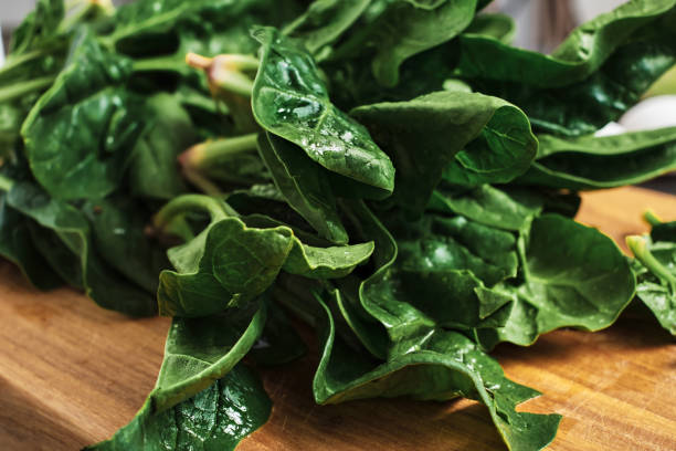 istock Spinach close up, selective focus. Organic food concept. Healthy eating 1355506966