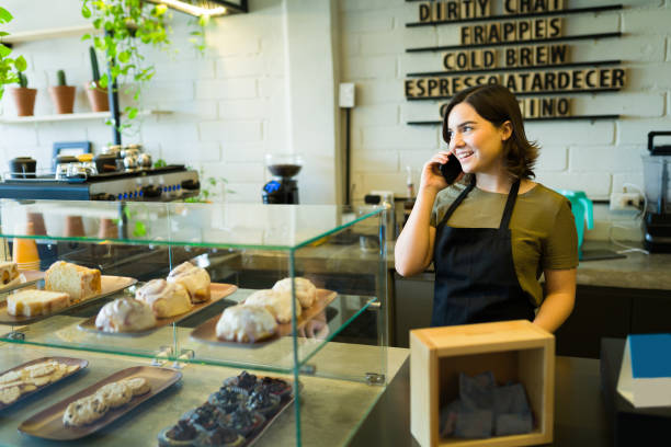 istock Waiter talking with a customer on the phone 1355508885