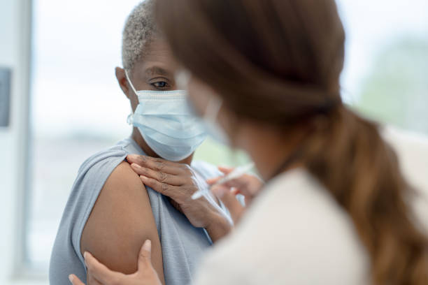 istock Senior Receiving Her Vaccination 1355510402