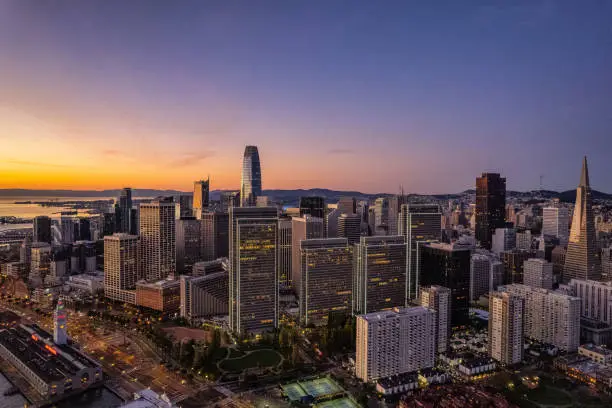 Photo of Aerial View of Sunrise behind San Francisco Skyline
