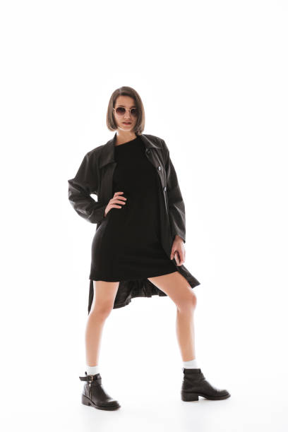 istock Concentrated young lady wearing sunglasses posing isolated 1355516653