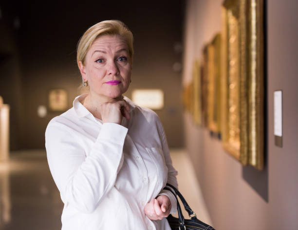 istock Closeup on mature female visiting museum 1355517026