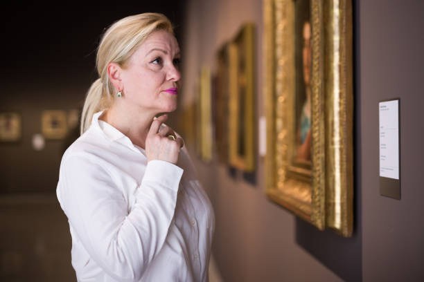 istock Closeup on mature female visiting museum 1355517041