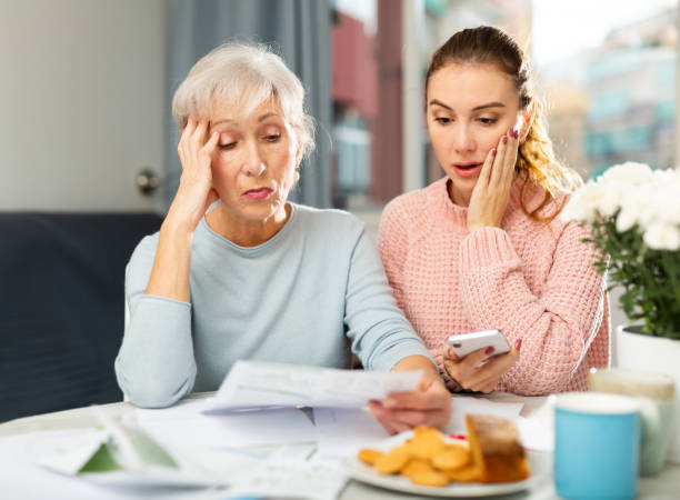 istock Mother and daughter feeling upset about financial problem 1355518541