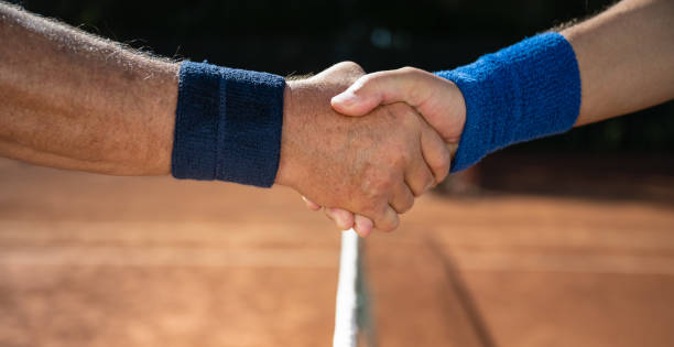 istock Two Tennis Players Handshake After Game 1355522487