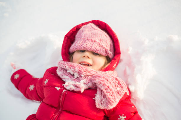 istock Little Girl In Snow 1355524445