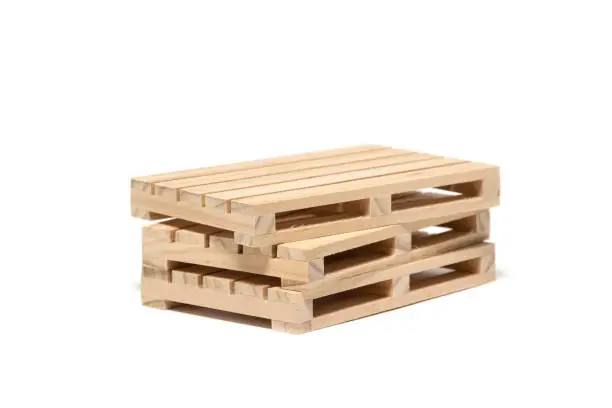 Wooden pallets for storing goods in a warehouse, isolated on a white background
