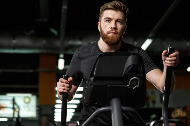 istock Concentrated young strong sports man make sport exercise 1355525962