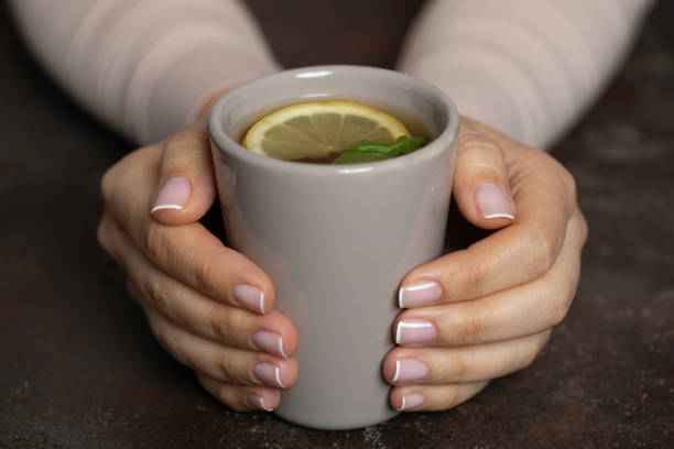 istock Woman with Herbal Tea 1355527207