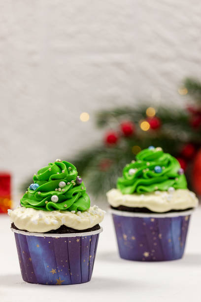 istock Cupcakes in the shape of a Christmas tree, Christmas decorations.Selective focus, place for text. 1355528471
