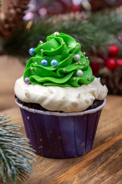 istock Cupcakes in the shape of a Christmas tree, Christmas decorations.Selective focus, place for text. 1355528479