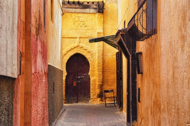 Narrow streets of in Meknes medina. Meknes is one of the four Imperial cities of Morocco and the sixth largest city by population in the kingdom. Narrow streets of in Meknes medina. Meknes is one of the four Imperial cities of Morocco and the sixth largest city by population in the kingdom. meknes stock pictures, royalty-free photos & images