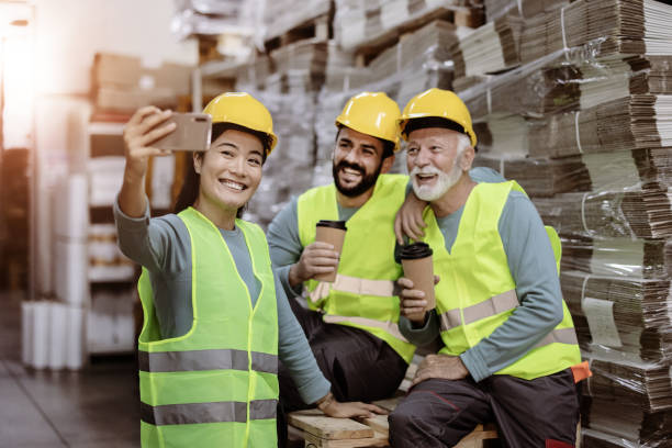 istock Big Smiles From Diverse Warehouse Team 1355532430