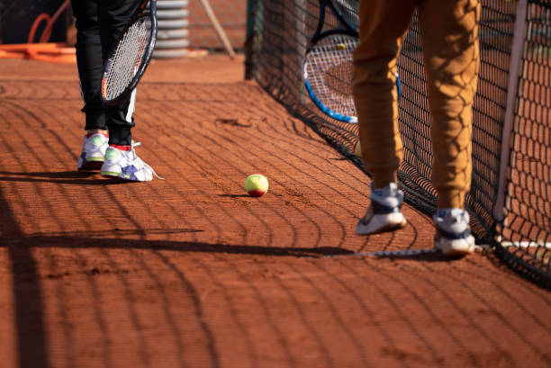 istock Close up two small tennis players practicing together. 1355532609