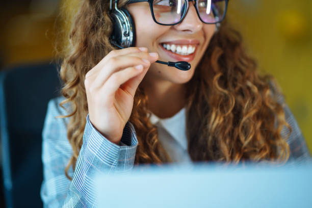 istock Young operator woman with headsets working in a call centre. 1355534410