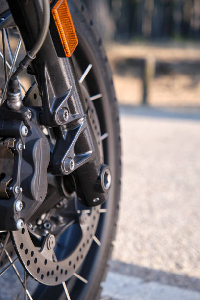 istock Front wheel with black tire of motorcycle 1355535289