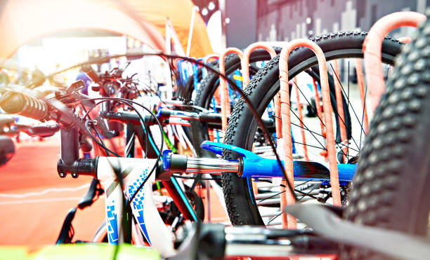 istock Bicycles on a vertical rack in store 1355535632