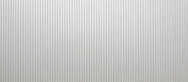 Photo of Texture of a corrugated sheet metal aluminum facade.