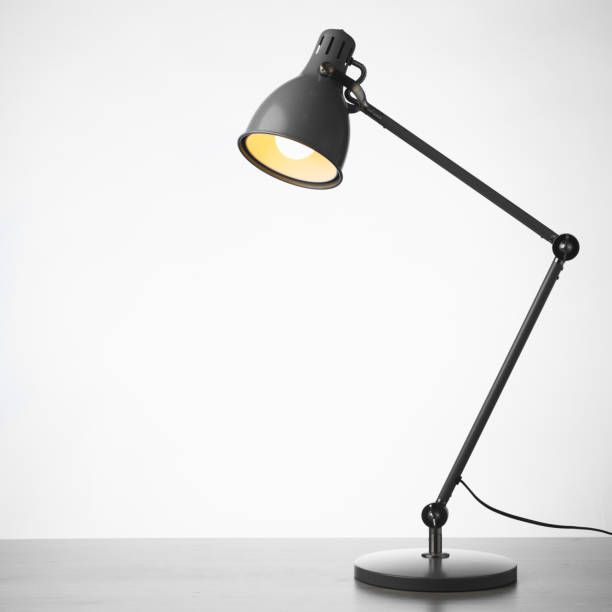 istock desk lamp on the table, white background 1355537810