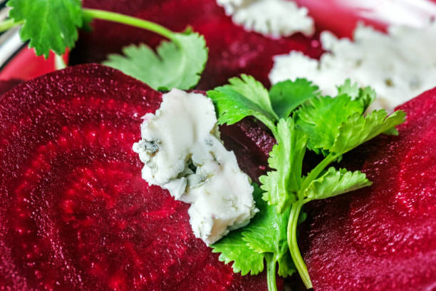 Pretty cheese with mold, beetroot and cilantro