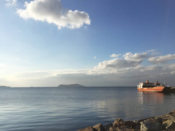 istock Ship in the port with sea and sky background 1355538089