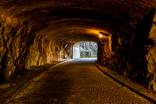Alley tunnel trough rock mountain