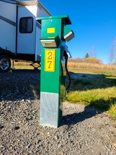 istock Campground RV Power Pedestal with Trailer Plugged in 1355545136