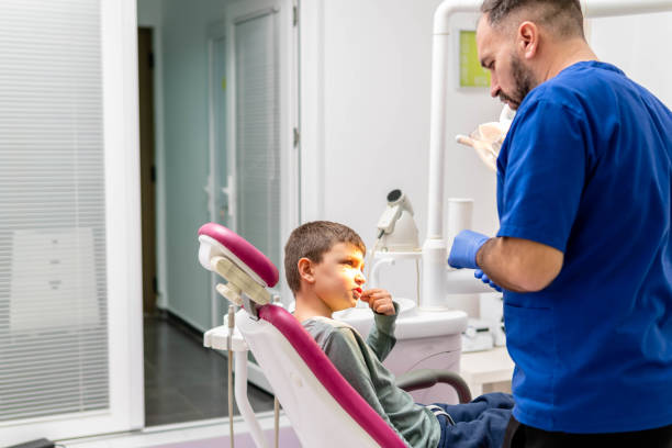 istock Child at the dentist. 1355545972