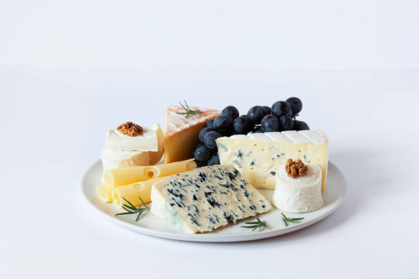 istock Cheese plate with grapes, walnuts and rosemary 1355547646