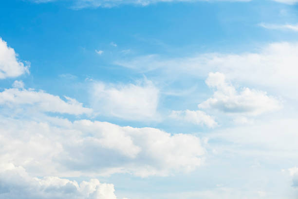 istock Blue sky background with fluffy cumulus clouds, atmospheric panorama 1355548646