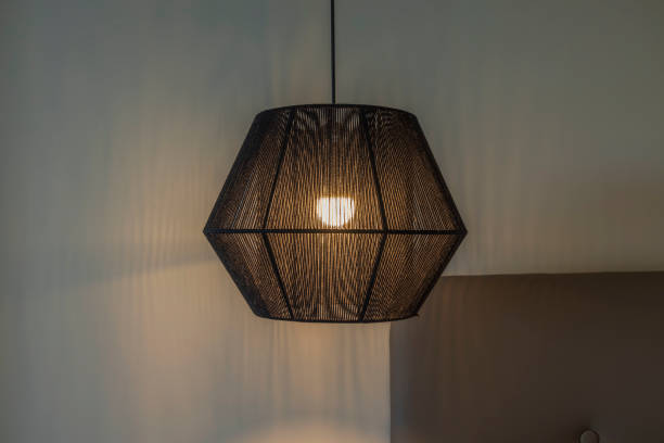 istock Close up view of beautiful modern black ceiling lamp. 1355549630
