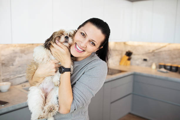 istock Woman and Her Puppy 1355554053