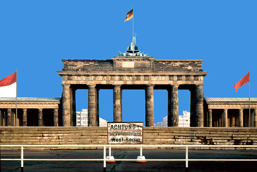 GDR barrier wall at the Brandenburg Gate in Berlin in December 1972 with a sign that reads 