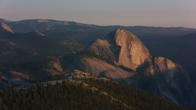 Yosemite, California circa-2021:  Aerial view of Half Dome in Yosemite National Park. Shot with Cineflex from Helicopter with RED 8K.
