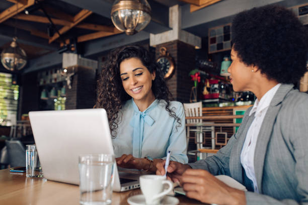 istock Two businesswomen making a business plan at the cafe 1355563695