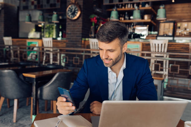 istock Businessman working online from the cafe 1355563764