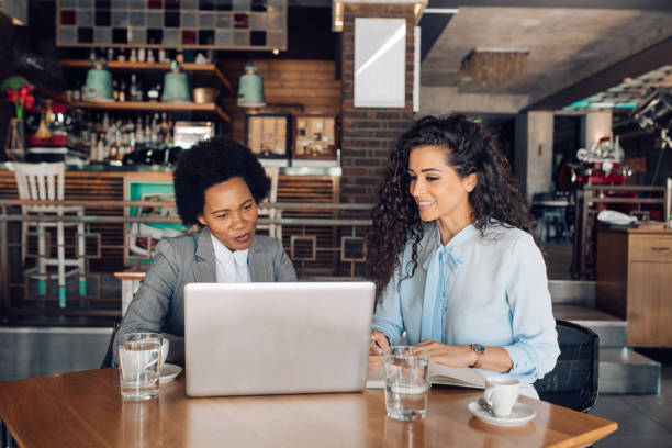 istock Two businesswomen making a business plan at the cafe 1355563795