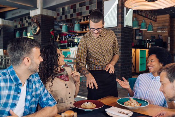 istock Group of colleagues getting their order at the restaurant 1355563822