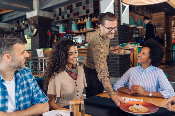 istock Group of colleagues getting their order at the restaurant 1355563842