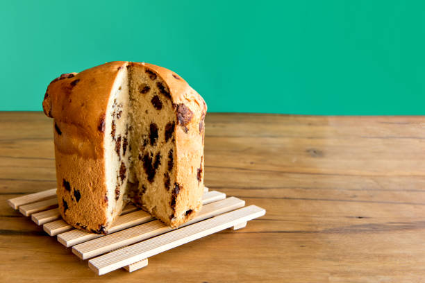 istock Panettone cut out on green background. Christmas dessert 1355566934