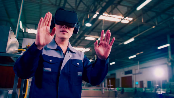 istock Engineer is using virtual reality glasses to inspect the factory's mechanical control system. 1355569538
