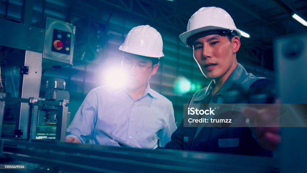 Machine Ownership An Engineer Is Explaining Remote Machine Control To Industrial Owners ...