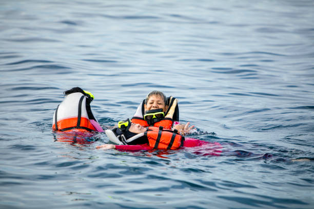 istock asian people snorkeling  in the sea 1355573207